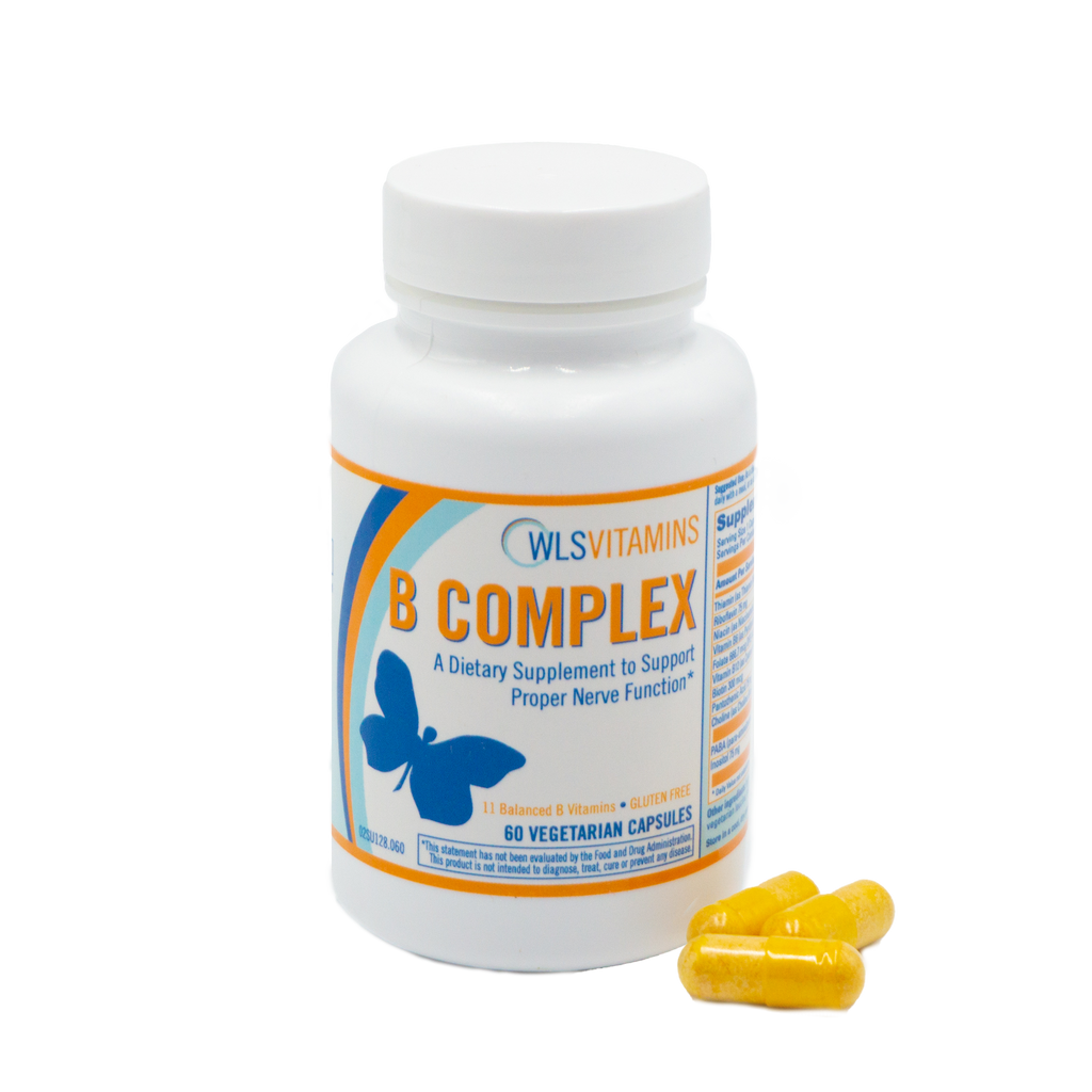 A bottle of WLS Vitamins B Complex dietary supplement with some capsules visible in front of the bottle.