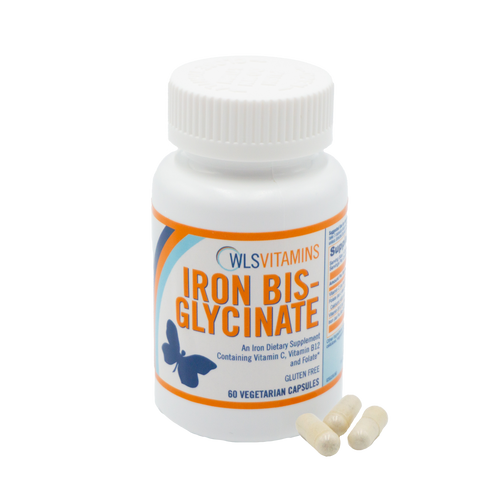 A bottle of Iron Bis-Glycinate supplements with some capsules visible in front of the bottle.
